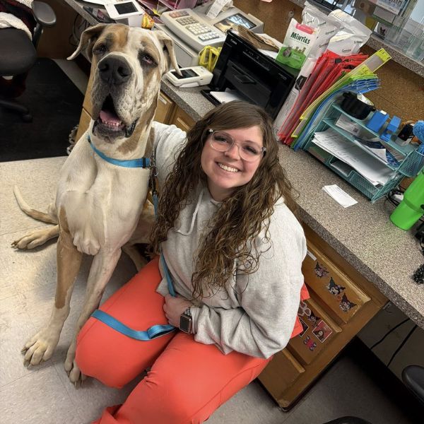 Front desk staff with a dog
